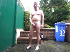 Handsom daddy jerking off in his back garden